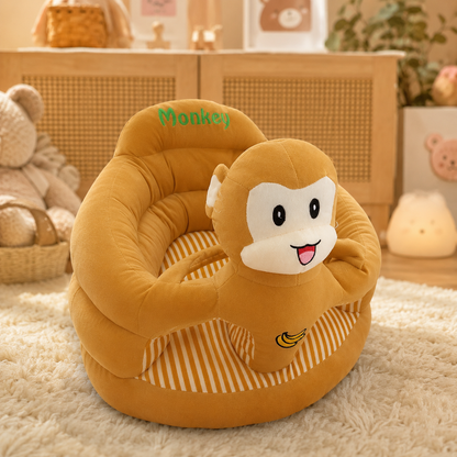 Monkey-shaped children's seat with 'Monkey' text on a soft surface.