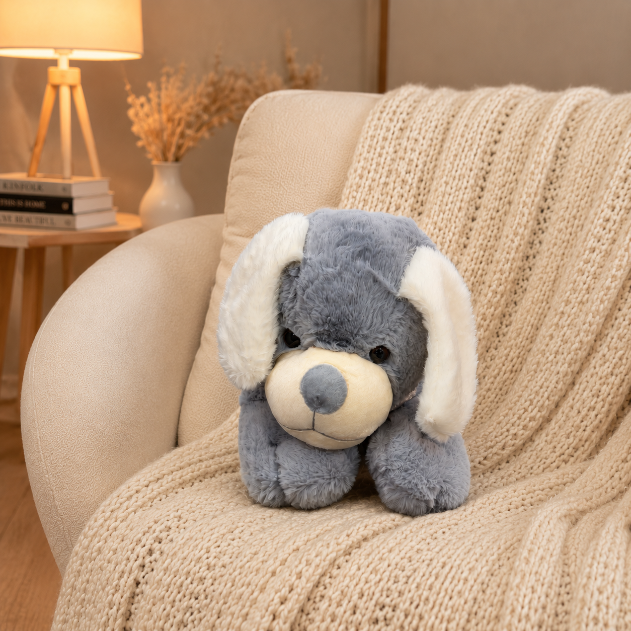 Plush dog toy on a beige armchair with a warm interior setting